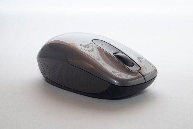mechanical gaming keyboard and a wired gaming mouse on a desk mat.